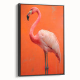 Framed canvas wall art featuring a vibrant flamingo design on a black background, showcasing tropical colors and modern decor style, ideal for enhancing living spaces.