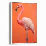 Framed canvas wall art featuring a vibrant flamingo design with shades of pink and white, elegantly displayed in a modern setting, perfect for adding a tropical touch to home decor.