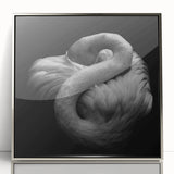 Framed wall art featuring a vibrant flamingo design with a sleek silver frame, ideal for modern decor, enhancing living spaces with tropical elegance.