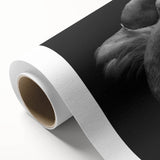 Vibrant rolled canvas artwork showcasing a flamingo design in pink and green hues, ideal for home decor, presented in protective cardboard packaging.