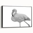 Framed wall art featuring a vibrant flamingo design, presented in a sleek black frame, showcasing a side view that highlights its modern aesthetic for home decor. This piece adds a colorful touch to any room, perfect for bird lovers and contemporary art enthusiasts.