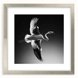 Elegant flamingo wall art framed in silver with a mat, showcasing vibrant pink and green colors, perfect for adding a tropical touch to home decor.