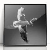 Framed acrylic wall art featuring a vibrant flamingo design on a black background, perfect for adding a tropical touch to home decor. Ideal for bird lovers.