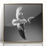 Framed acrylic wall art featuring a vibrant flamingo design with gold accents, showcasing a contemporary style perfect for modern home decor. The piece emphasizes bright colors and intricate details, ideal for adding a touch of elegance to living spaces.