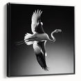 Framed canvas wall art showcasing a vibrant flamingo design in pink and black, displayed in a sleek black frame from a side view, perfect for modern decor.