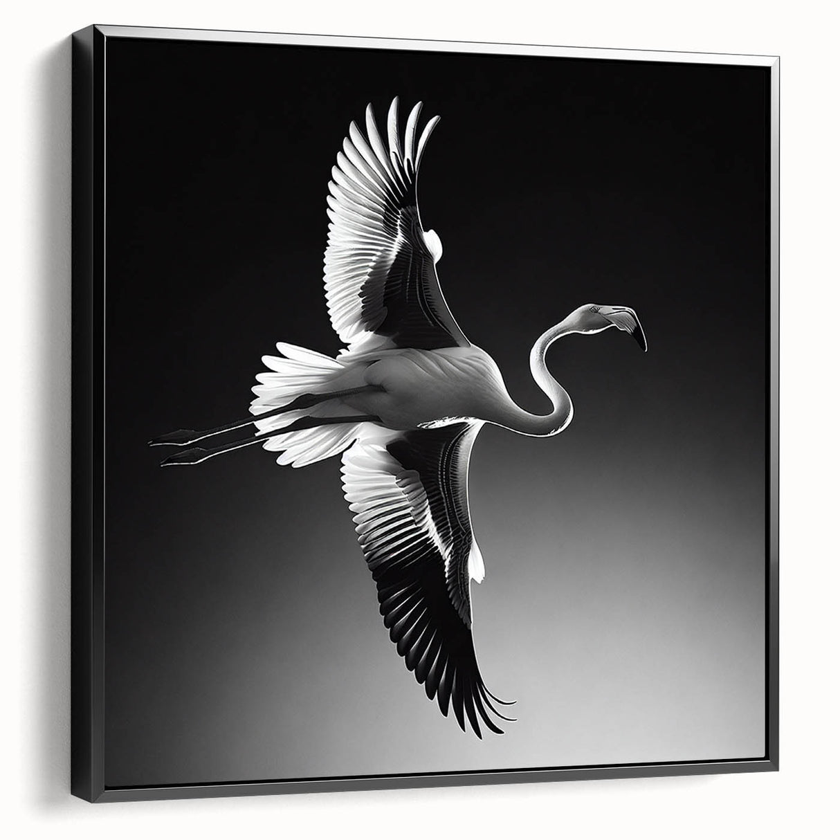Framed canvas wall art showcasing a vibrant flamingo design in pink and black, displayed in a sleek black frame from a side view, perfect for modern decor.