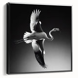 Framed canvas wall art showcasing a vibrant flamingo design in pink and black, displayed in a sleek black frame from a side view, perfect for modern decor.