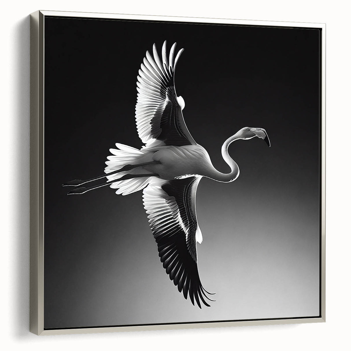 Framed canvas wall art featuring a vibrant flamingo design, accented with a sleek silver frame, ideal for modern home decor. Perfect for adding a tropical touch to any room.