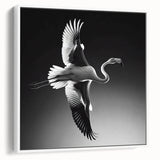 Framed wall art featuring a vibrant flamingo design on a white background, showcasing tropical colors and a modern aesthetic, perfect for home decor.