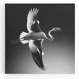 Vibrant flamingo wall art design on stretched canvas, showcasing bold pink hues and tropical foliage, perfect for enhancing modern home decor.