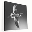 Stretched canvas wall art featuring a vibrant flamingo design in pink and green hues, showcasing tropical themes and perfect for enhancing home décor.