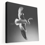 Stretched canvas wall art featuring a vibrant flamingo design in pink and green hues, showcasing tropical themes and perfect for enhancing home décor.