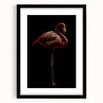 Framed wall art showcasing a vibrant flamingo design in a modern black frame with a white mat, ideal for enhancing contemporary decor and bringing a pop of color to any space.