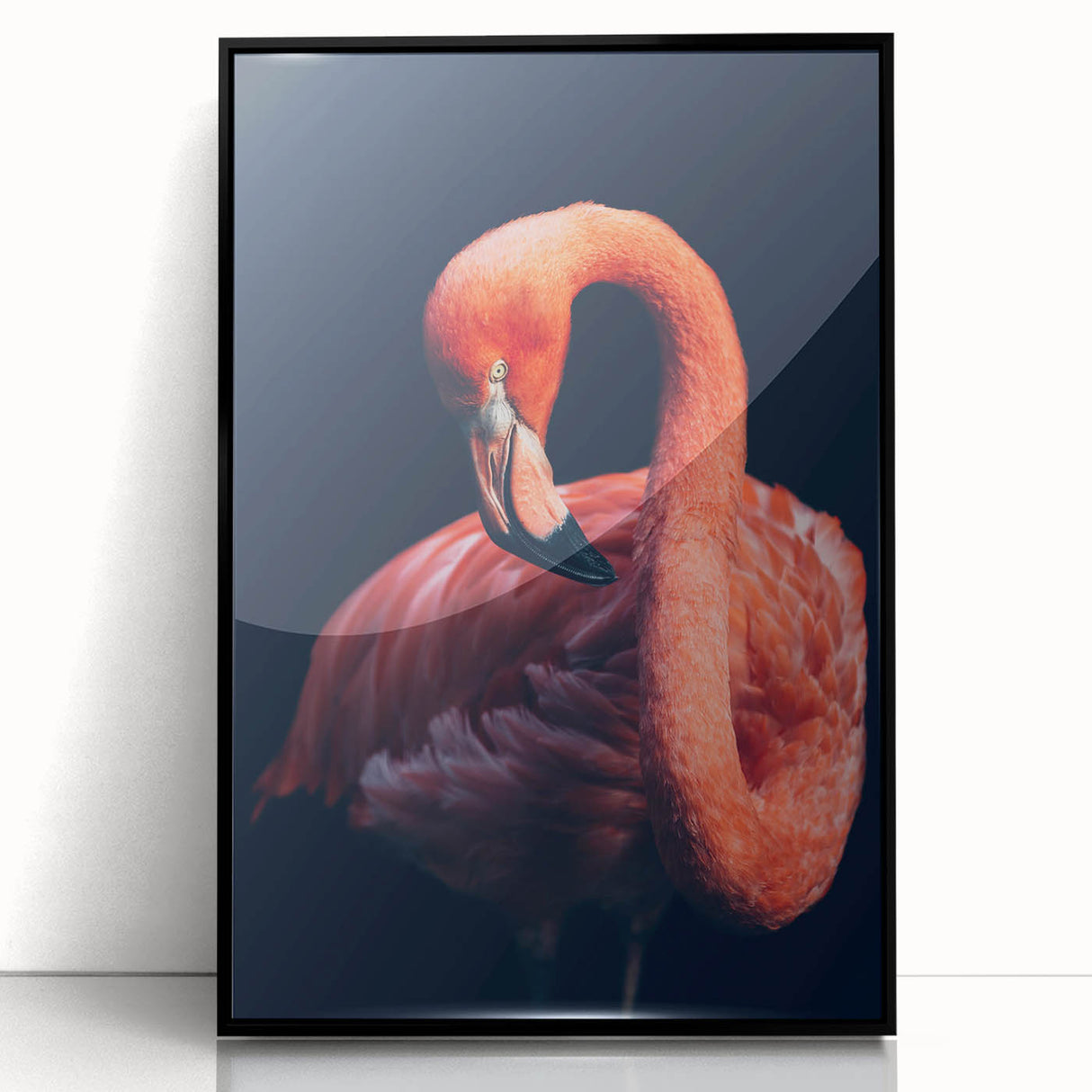 Framed wall art featuring a vibrant flamingo design on acrylic, set in a sleek black frame, perfect for adding a tropical touch to home decor.