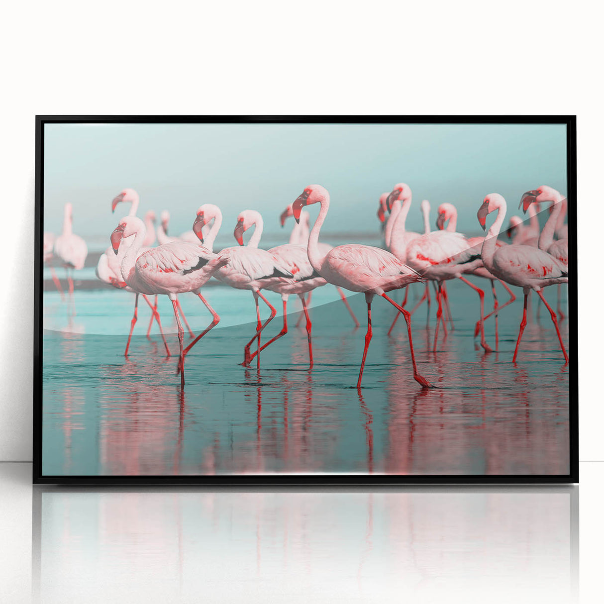 Framed wall art featuring a vibrant flamingo design on acrylic, set in a sleek black frame, ideal for modern home decor. Perfect for adding a colorful touch to any room.