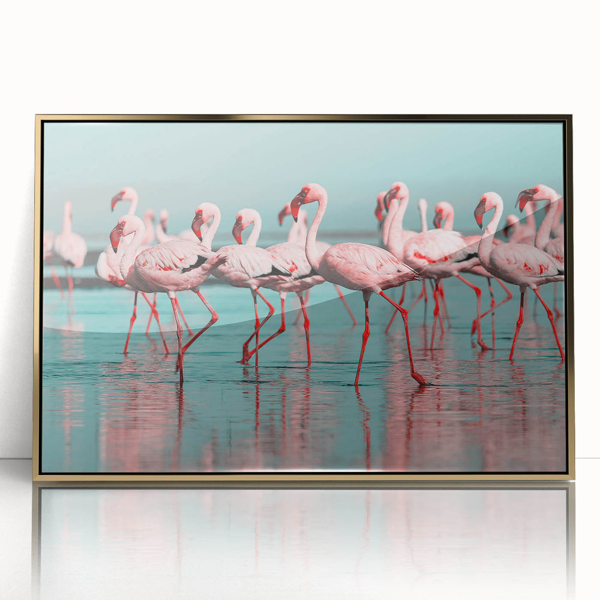 Framed wall art featuring a vibrant flamingo design with gold accents, displayed in a sleek acrylic frame, perfect for adding a tropical touch to home decor.