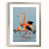 Framed wall art featuring a vibrant flamingo design in shades of pink and green, elegantly presented in a silver frame with a mat, perfect for enhancing any modern decor.