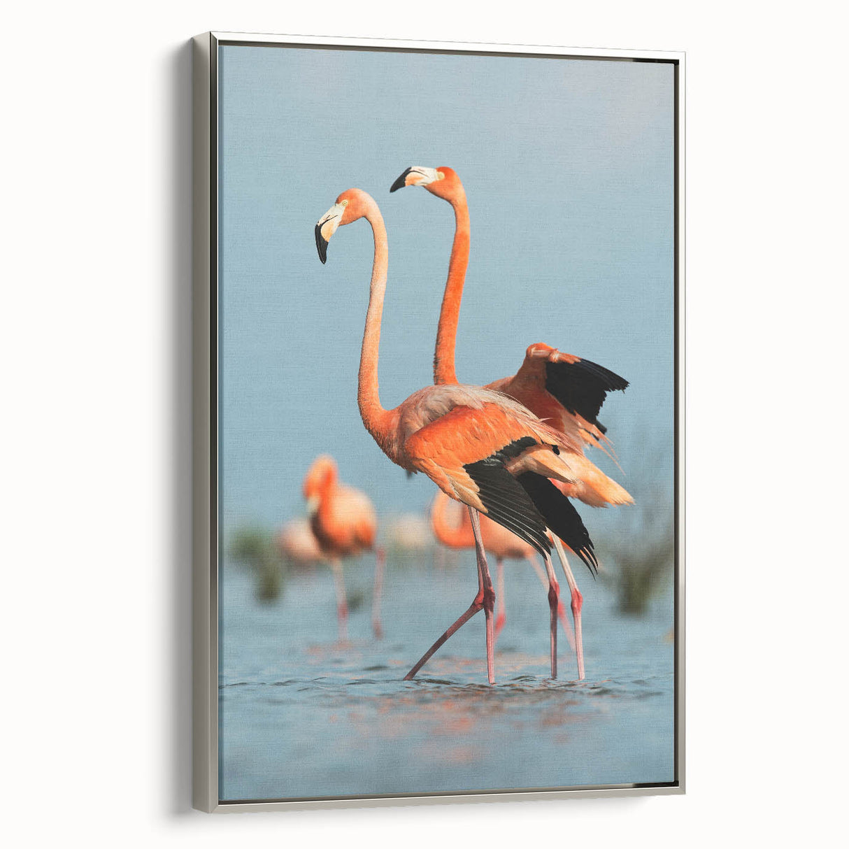 Framed wall art featuring a vibrant flamingo design in shades of pink and green, elegantly displayed with a sleek silver frame, perfect for home decor enhancement.