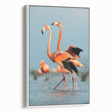 Framed canvas wall art featuring a vibrant flamingo design in shades of pink and white, displayed from the side against a minimalist backdrop, ideal for modern decor.