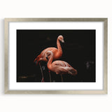Framed wall art featuring a vibrant flamingo design in a silver frame, with a white mat surrounding the artwork, ideal for home decor and tropical-themed interiors.