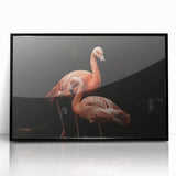 Framed acrylic wall art featuring a vibrant flamingo design in shades of pink and green, with a sleek black frame, ideal for modern home decor.