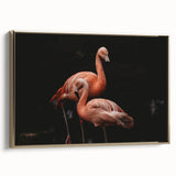 Framed canvas wall art featuring a vibrant flamingo design with gold accents, displayed from a side view, perfect for adding a tropical touch to home decor.