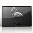 Framed acrylic wall art featuring a vibrant flamingo design in pink and green hues, presented in a sleek black frame, ideal for modern home decor.