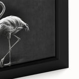 Vibrant close-up of a framed canvas wall art featuring a pink flamingo design, showcasing intricate details and textures against a soft blue background, ideal for home decor.