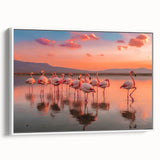 Framed canvas wall art featuring a vibrant flamingo design, elegantly displayed in a white frame, perfect for adding a tropical touch to modern decor.