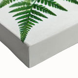 Close-up of a stretched canvas featuring a vibrant garden birds design, showcasing colorful birds perched among lush greenery, perfect for nature-inspired decor.