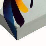 Close-up of a vibrant birds garden wall art design on stretched canvas, showcasing intricate details of colorful birds amidst lush greenery, perfect for home decor.