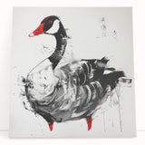 Stretched canvas wall art showcasing a serene goose design with vibrant colors, leaning against a neutral wall, perfect for modern home decor.