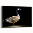 Framed canvas wall art featuring a graceful black goose design, set against a neutral background. The side view highlights its sleek frame and modern aesthetic, perfect for adding elegance to home decor. Ideal for bird lovers and nature enthusiasts.