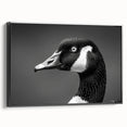 Framed canvas wall art featuring a stylish goose design in a modern black frame, showcasing vibrant colors and intricate details, perfect for home decor.