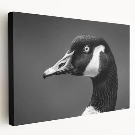 Stretched canvas wall art featuring a serene design of geese in flight against a soft blue background, perfect for enhancing home decor with nature-inspired elegance.