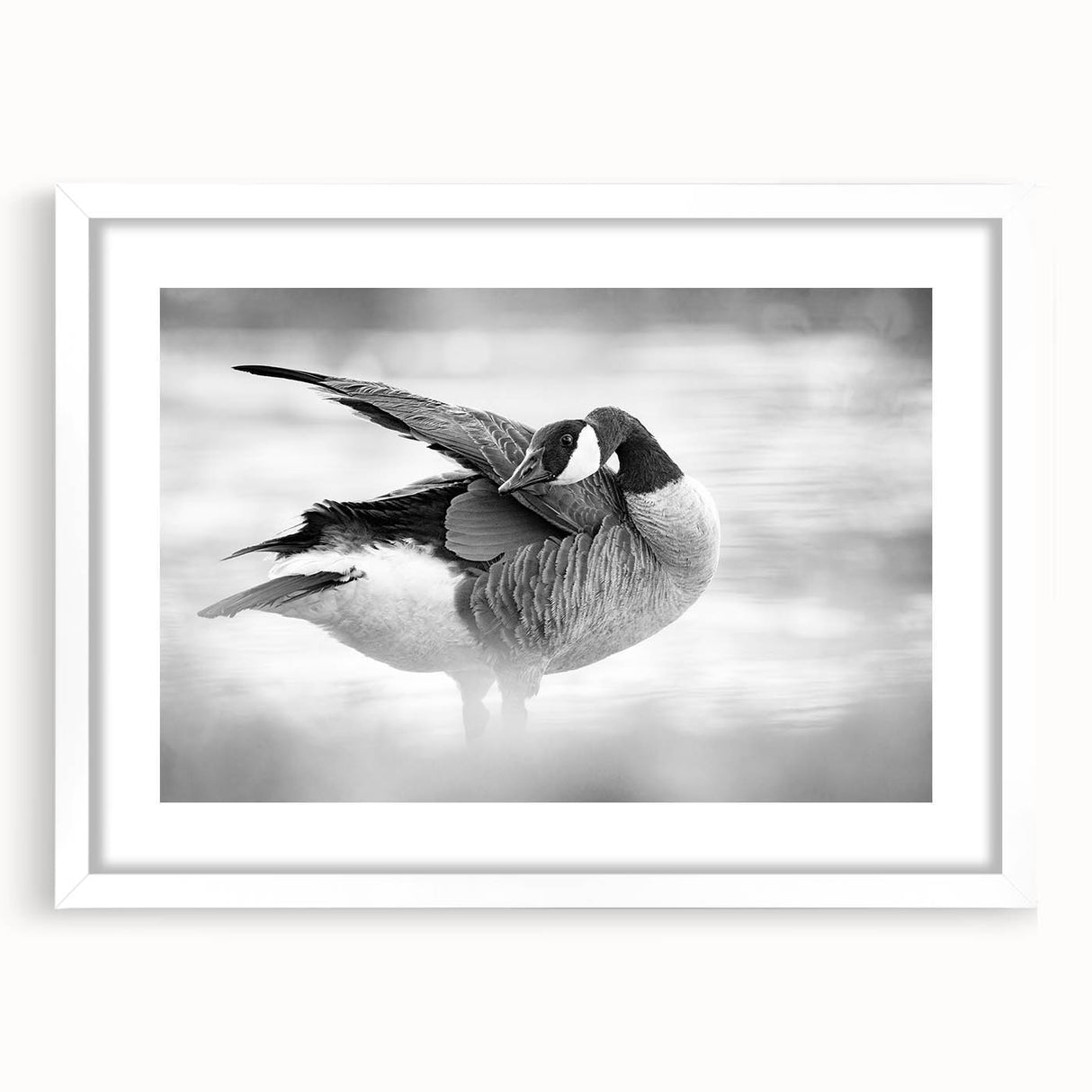 Framed wall art featuring a minimalist goose design in a white mat, ideal for modern home decor. The artwork is set against a clean background, emphasizing its elegant lines and serene aesthetic. Perfect for adding a touch of nature-inspired elegance to any room.