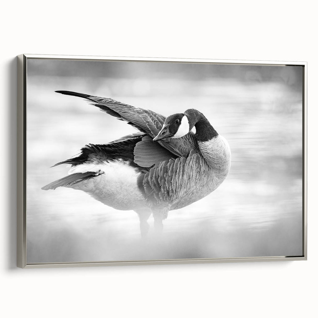 Framed canvas wall art featuring a serene goose design in silver tones, showcasing elegant details and a modern aesthetic, perfect for enhancing home decor.
