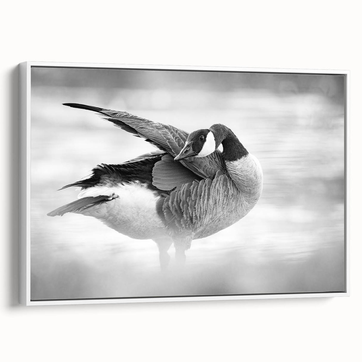Framed wall art showcasing a minimalist goose design on canvas, presented in a sleek white frame, ideal for modern home decor and accent walls.