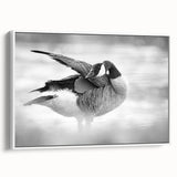 Framed wall art showcasing a minimalist goose design on canvas, presented in a sleek white frame, ideal for modern home decor and accent walls.