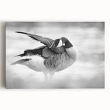Stretched canvas wall art featuring a serene goose design in soft blues and whites, perfect for enhancing home decor with a touch of nature-inspired elegance.