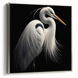 Framed wall art showcasing a silver heron and egret design on canvas, elegantly displayed from a side view, ideal for nature-inspired home decor.