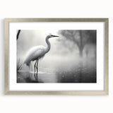 Framed wall art featuring a detailed design of herons and egrets, elegantly matted and presented in a sleek silver frame, ideal for enhancing home decor.