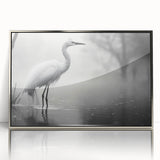 Framed acrylic wall art featuring a heron and egret design, showcasing intricate details and a silver finish, perfect for enhancing modern decor.