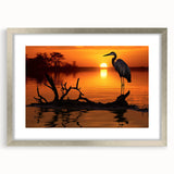 Framed wall art collection showcasing elegant heron and egret designs in a silver frame, featuring a mat for a polished look, ideal for nature-inspired decor.