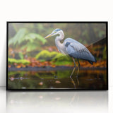 Framed wall art featuring a heron and egret design on a black background, showcasing intricate details and vibrant colors, ideal for modern home decor.