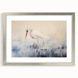 Framed wall art featuring a heron and egret design, showcasing delicate birds in a serene setting. The art is elegantly presented in a silver frame with a mat, enhancing its aesthetic appeal for home decor.