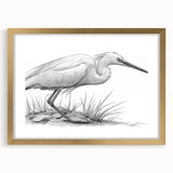 Elegant framed wall art displaying a heron and egret design, featuring a gold frame and matting. Perfect for nature-inspired home decor in any setting.