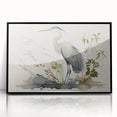 Framed wall art featuring a heron and egret design, showcasing intricate details in black and white with a sleek black frame, perfect for modern decor.