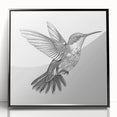 Framed acrylic wall art featuring a vibrant hummingbird design in shades of blue and green, set against a sleek black frame, perfect for modern decor.