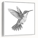 Framed canvas wall art featuring a vibrant hummingbird design in multicolored hues, set against a clean white background, showcasing a modern aesthetic ideal for home decor.